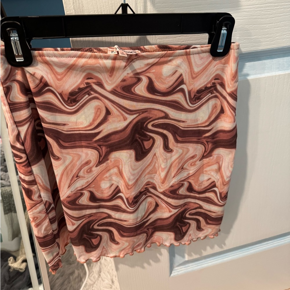 Pink+Brown swirl-patterned mini skirt with a sheer overlay, lettuce-edge hem